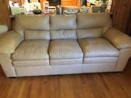#41 tan simulated leather 8ft sofa $250.00