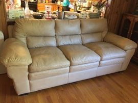 #41 tan simulated leather 8ft sofa $250.00