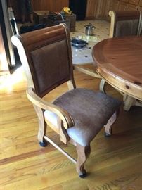 #45 Pine table w 1 leaf, 65x48x30.5 w/4 chairs on wheels $225.00
