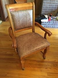 #45 Pine table w 1 leaf, 65x48x30.5 w/4 chairs on wheels $225.00