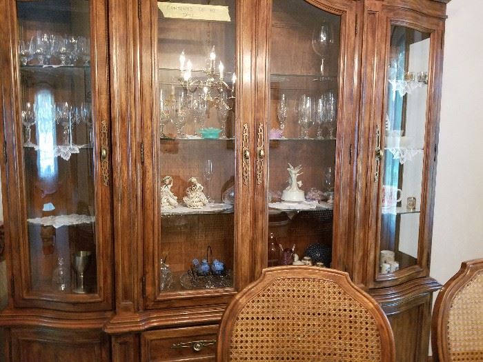 Dining room set stays with the house,  the contents of the hutch are for sale....
