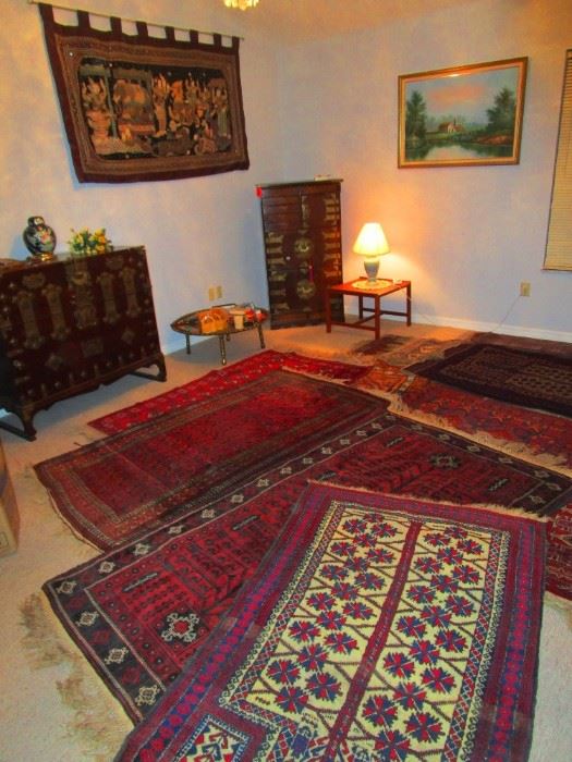 A collection of fine Afghan area carpets representing the various regions and styles of that land, Chinese rosewood cabinets with  brass fittings, old style brass fish locks and secret drawers and  a mid century teak lamp table from Denmark 