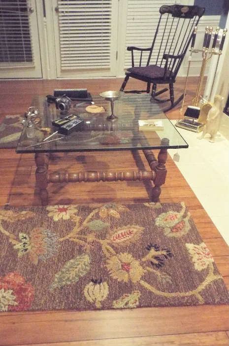 glass-top coffee table, rugs & rocking chair