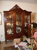 Large china cabinet with 3 doors ( with keys ) and 3 drawers along bottom.