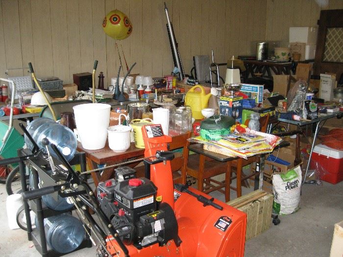 One More Shot of Garage, Lawn Chairs, Wheelbarrow, Cart, Pots, Water Bottle Holder with Bottles, Coolers and so much more...