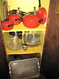 red pots, aluminum tray, lots of pots and pans