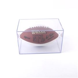 Brian Urlacher Signed Football: A Brian Urlacher signed football. Features a Wilson NFL football with the autograph of eight-time Pro Bowl linebacker Brian Urlacher in black ink to a white panel. The football is presented in a clear Plexiglas case.