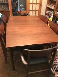 Mid Century Modern dining table with leaf.