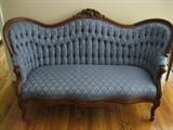 Victorian Love seat with orginial upholstry and framing. H: 36"; D: 26"; L: 61"