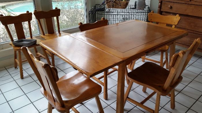 Draw leaf table with six chairs