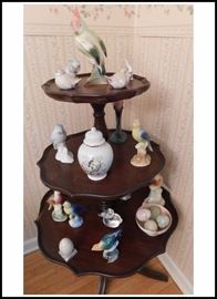 Three-tiered table with collectible birds, bunny and duck figurines 