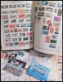 Collectible domestic and foreign postage stamp album and loose stamps