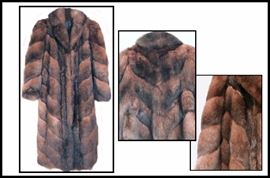 Natural opossum full length fur coat. Reverses to a rain slicker. 50"-52" long. Estimated size 14-20. Excellent condition. Purchased at Galleria in Edina 25-30 years ago. 