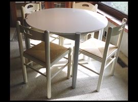 40 inch round white table with four rush seat chairs