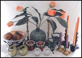 Collection of decorative brass, glass, ceramic, and wooden candle holders
