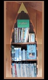  DVDs and books on CDs and a boat shaped wooden shelf