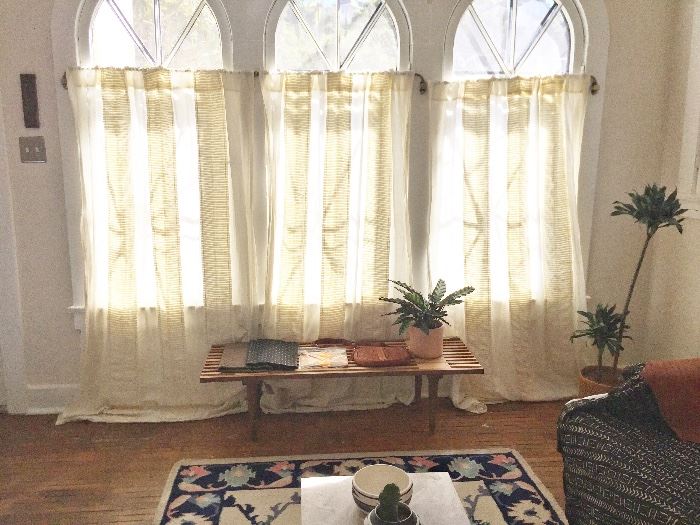 Anthropologie curtains, Midcentury style slat bench/coffee table, plants