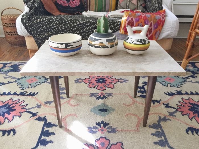 Midcentury coffee table, Native American pottery, plants, handwoven Indian rug