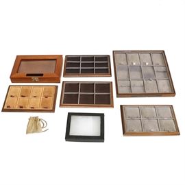 Velveteen Lined Display Trays: An assortment of velveteen lined display trays. Trays include a combination of red, black, and even green linings and red and black boxes. Some trays are open, and others are divided, and others include removable inserts.