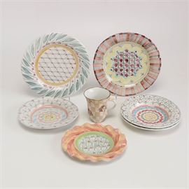 Selection of Mainly MacKenzie-Childs Ceramic Tableware: A selection of mainly colorful MacKenzie-Childs mixed tableware. This grouping includes a large floral ruffled serving dish, a fish platter by Vietri, a mug, soup bowls and ruffled plates. All pieces bear the maker’s mark to the underside.