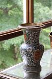BRASS AND PORCELAIN VASE
