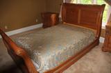 QUEEN BED. SLEIGH. KNOTTY PINE. BED. ARMOIRE AND BEDSIDE TABLES.