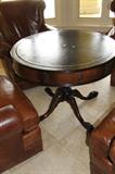 LEATHER TOP DRUM TABLE WITH PAW FOOT LEGS