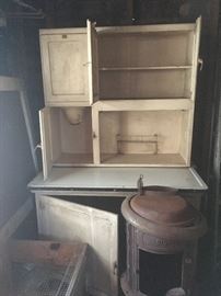 White wooden hooiser cabinet & cast iron pot belly stove (w/broken leg)