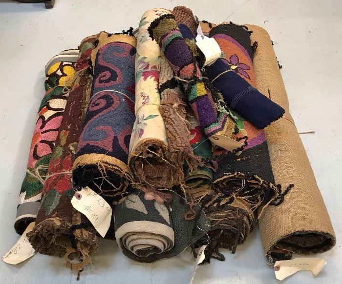 A Pile of Hooked Rugs