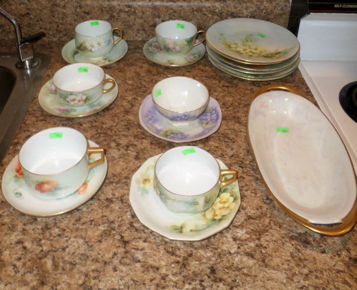 some lovely hand painted porcelain cups & saucers