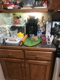 Toaster oven, coffee pot, cup holder, miscellaneous other kitchen items 