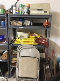4 chairs & card table in garage. All items on shelves and the shelves are for sale