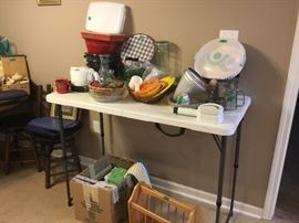 Found more kitchen items' kitchen towels, and pot holders. Wooden magazine rack