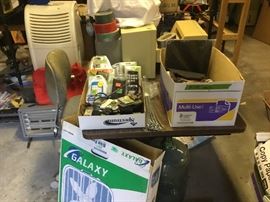 These next pictures show as much as I could of the larger of 2 buildings behind the house. Desk, rolling chair & galaxy fan in box.