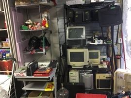 More electrical, computer monitors , tiered stand, stuffed animals, shelf.