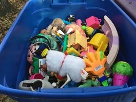 Tubs of McDonald's toys _ outside behind the house