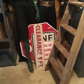 Several signs: STOP, Trans-Am parking, and more