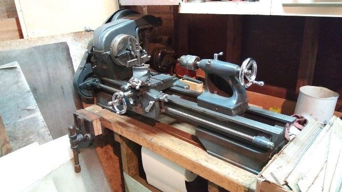 Vintage Craftsman / Atlas Metal Lathe with Wood Bench base and wood Vise. Works great. Includes cutting blades and other accessories.