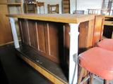 Great rolling bar or counter made from old doors and columns on nice big casters that lock to make it easy to move around.