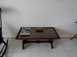 COFFEE TABLE WITH CARVED, TRESTLE BASE