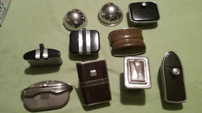 collection of "new" old automobile ashtrays from the mid 1930's. These were collected by an employee of the factory where they were made. Never installed in a car. 