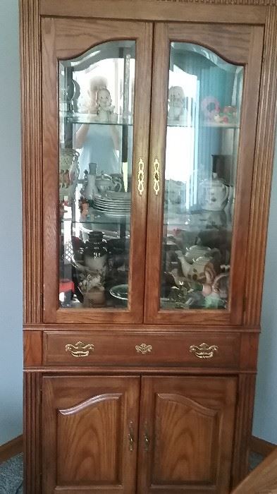 large lighted china / display cupboard. Glass shelves and glass front with storage cabinet below. 