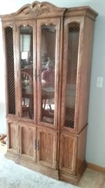 large lighted china cupboard with glass shelves, storage on bottom  Comes apart and can be moved in two pieces. 