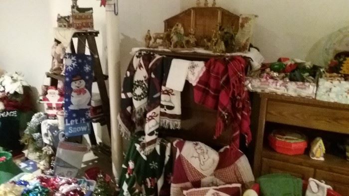room full of Christmas....ornaments, blankets. throws, candles, trees, candles, decorations, Nativity, 