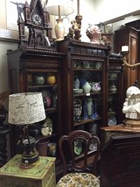 Aesthetic Movement Bookcase filled with Art Pottery (Moorcroft, Rookwood, Cowan, Roseville, Doulton, Gouda, Longwy, Boch Frère, etc), Majolica, and Hand-painted Limoges Porcelain. Tramp Art Clock, Durand Glass Lamp, Gilt-wood and Ceramic Sculptures.
