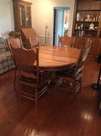 #62  Oak Pedistal Table with leaf and 6 chairs  53.5-74 Width    $250