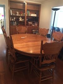#62  Oak Pedistal Table with leaf and 6 chairs  53.5-74 Width    $250