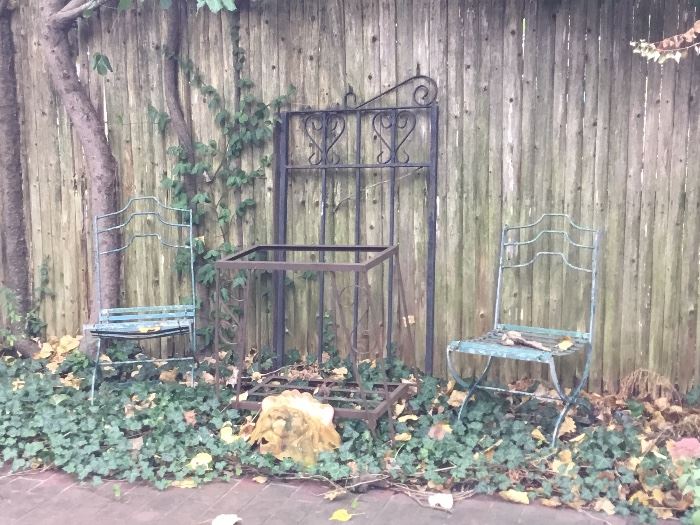 Wrought iron garden furniture and decorative iron pieces and cement statues 