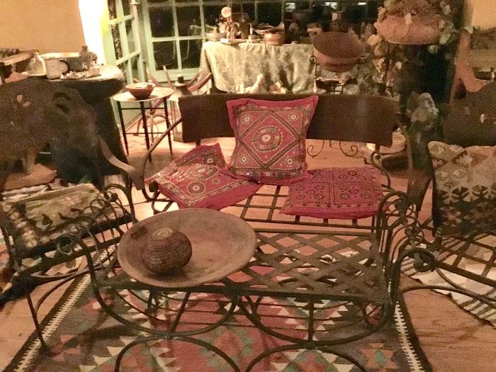 Group of antique wrought iron chairs, loveseat and table. Indian hand stitched pillows, killom rug