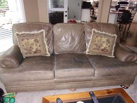 Leather sofa/couch and matching chair with ottoman. Pillows not for sale